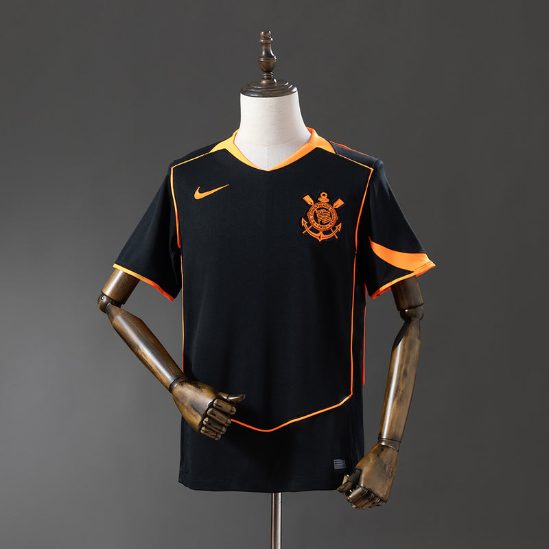 Camiseta Corinthians 25/26, color negro y naranja.